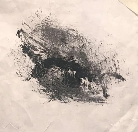 Eye — gestural charcoal and ink eye study on crumpled white paper